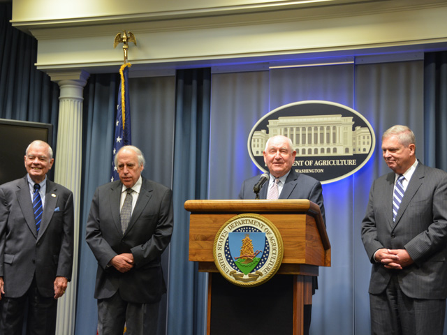 Secretary of Agriculture Sonny Perdue, at the podium, hosts a press event with three of his predecessors, John Block, Dan Glickman and Tom Vilsack, to promote the USMCA trade agreement. (DTN photo by Chris Clayton)
